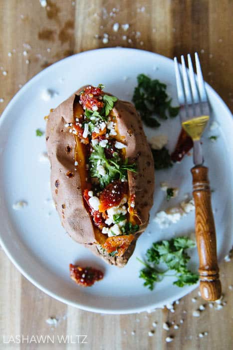 Looking for a grown up version of the baked sweet potato? I made this savory baked sweet potato stuffed with feta and sundried tomatoes.
