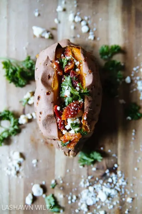 Baked sweet potatoes stuffed with feta and sundried tomatoes..it's not your mama's sweet potato...