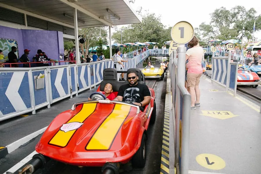 riding in the cars at disneyworld's tomorrowland speedway. 