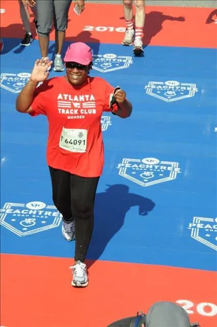 Me, crossing the finish line at the Peachtree