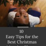 tips to take christmas morning photos. kid smiling near christmas tree