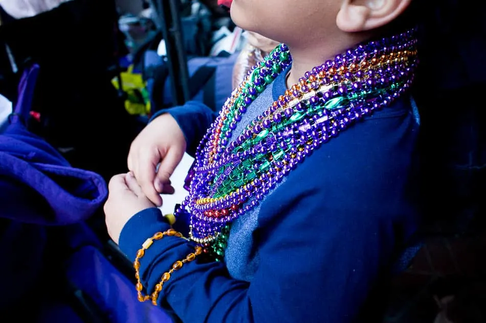 Kids love to collect beads from Mardi Gras