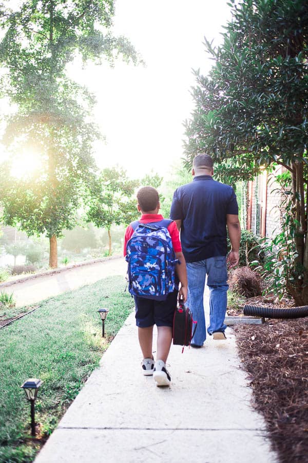 walking together on the first day of school after saying these easy mantras for your kids
