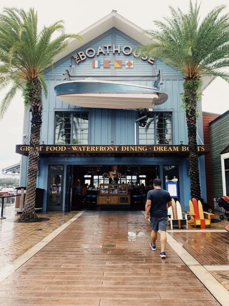 man walking to boathouse restaurant in disney springs