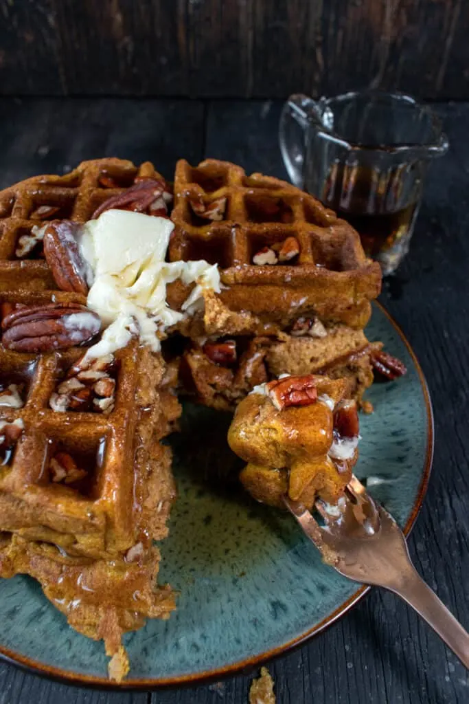 These Gluten-free Pumpkin Waffles are loaded with delicious flavor, are easy to make, and are the leftover waffles are freezer-friendly!  These pumpkin waffles are perfect for the fall and winter months.