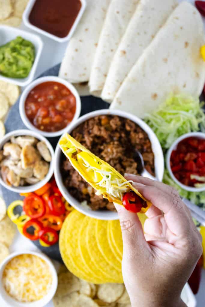 This Taco charcuterie board is the perfect way to celebrate Taco Tuesday or have at your Cinco De Mayo Party.  Building Your own Taco charcuterie board is a  wonderful way to enjoy Mexican-inspired cuisine. 