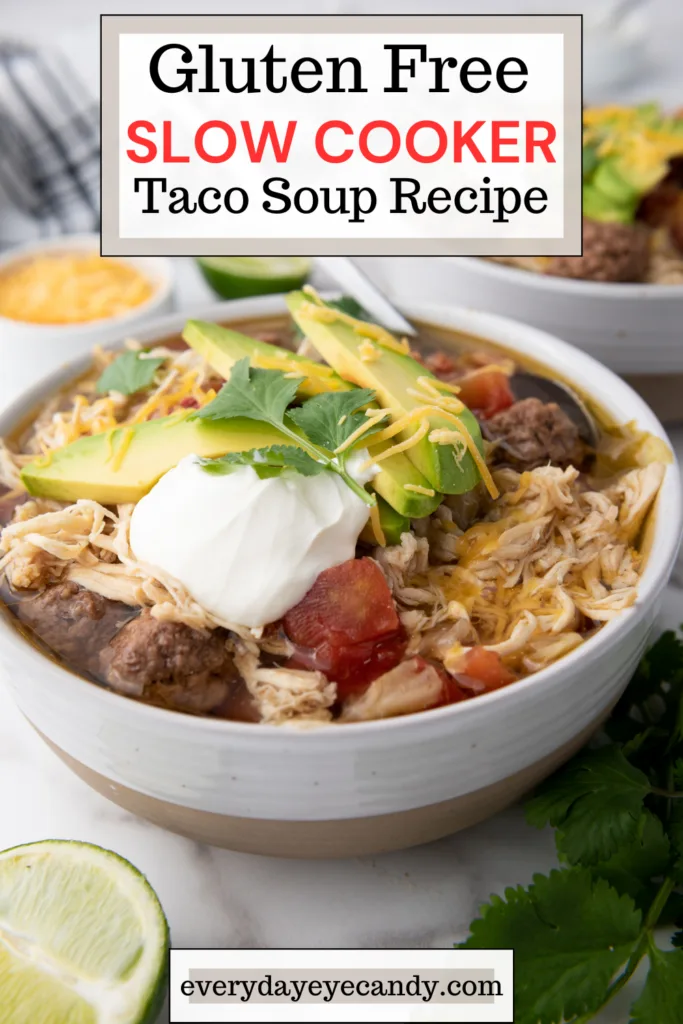 This easy recipe for Slow Cooker Gluten Free Taco Soup is the perfect weeknight meal!  It combines ground beef seasoned with taco spices, tomatoes, chicken breast and more, for a delicious easy taco soup recipe. Made in the crockpot, it's gluten-free and a great choice for meal prep too.
