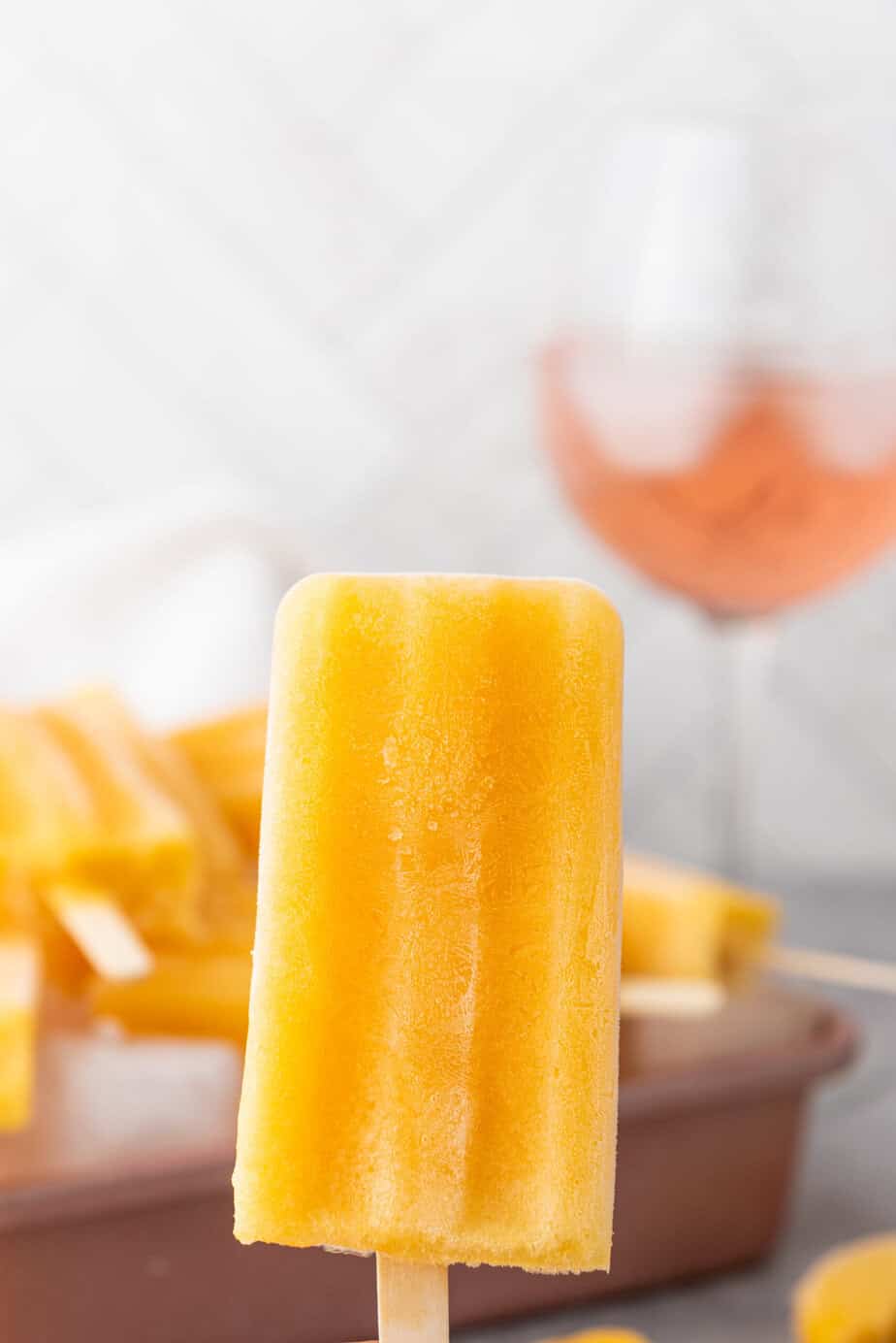 These Peach Rosé  Wine popsicles are boozy treats inspired by everyone's favorite summer wine! 