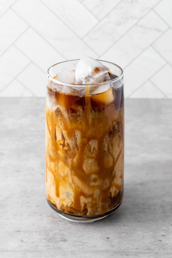 This easy homemade caramel iced coffee recipe is easy to make and is ready in only 5  minutes! Perfect way to get your favorite coffeehouse drink right at home.