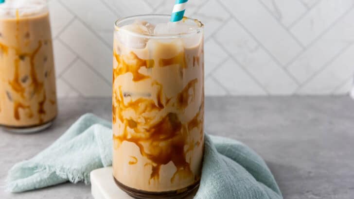 iced caramel coffee on a table in a glass with a straw